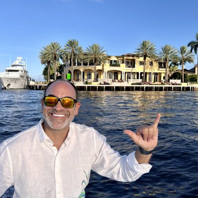 Brian Fabiano on the water in a white linen shirt