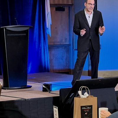 Brian Fabiano speaking on a conference stage