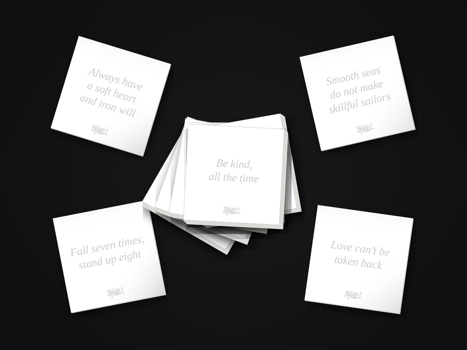 Six white Fabisms sticky-note pads fanned out in a pile, with four single sheets pulled from the stack around it, each printed with a Fabism in faint gray italic type and a small Fabism’s by FabSailer logo